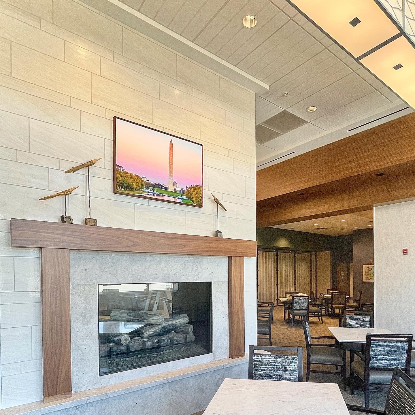 framed-cityscape-artwork-lounge-fireplace-commercial-interior-install